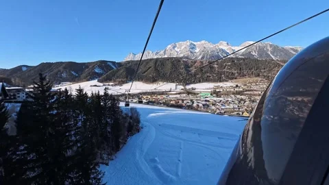 Panoramic View over Ski Slopes and Snowy Forests during Ascent in Schladming Stock Footage 320782281