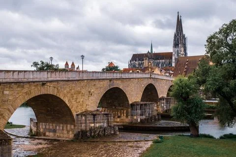 Panoramic view over the Stone Bridge to the Regensburg Cathedral in Germany. Stock Photos