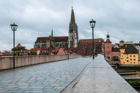 Panoramic view over the Stone Bridge to the Regensburg Cathedral in Germany. Stock Photos