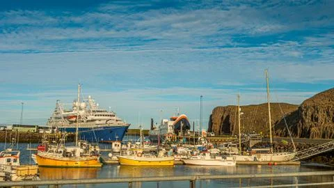 Panoramic view over sunset at Stykkisholmur (Stykkish) downtown and harbor wi Stock Photos