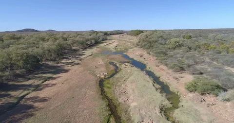 Panoramic view over wide sandy river bed in the dry season in Africa Stock Footage 95914873