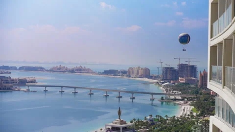 Panoramic View of Palm Jumeirah with Bridge and Tethered Balloon Over Coastal. Stock Footage 337903973