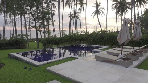 Panoramic view of a palm tree the sea and the pool on tropical the resort of Stock Footage