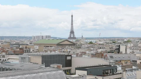 Panoramic View of Paris Skyline with Eiffel Tower and City Rooftops under Cloudy Stock Footage 337052389