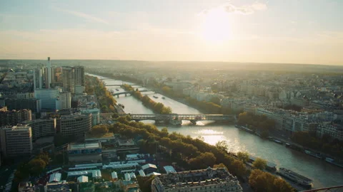 Panoramic view of Paris at sunset with the Seine River and city skyline. Paris Stock Footage 313417358