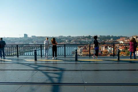 Panoramic view with people looking from behind to Douro River. City of Porto. Stock Photos