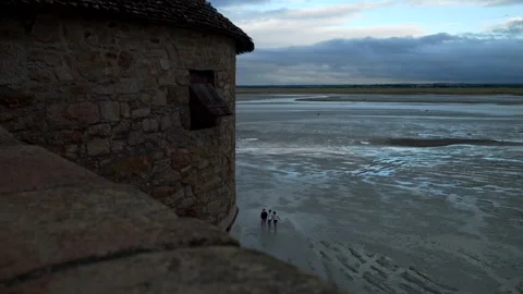 Panoramic view people walking on the bay during low tide. Panning 4K Video stock 292096641