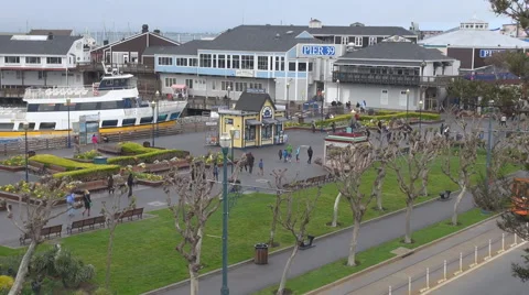 Panoramic view of Pier 39 tramway pass and pedestrian people walk San Francisco Stock Footage 65479821