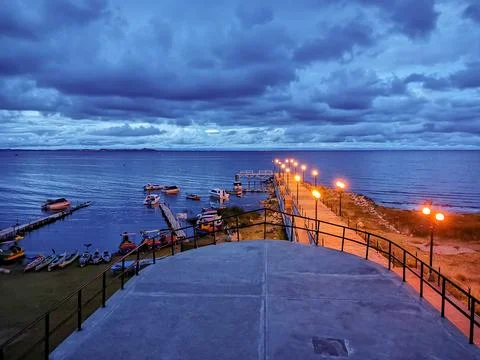 Panoramic view of pier at sunset with sky with clouds Stock Photos