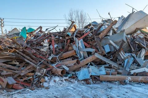 Panoramic view of a pile of rusty scrap metal at a landfill for recycling Stock Photos