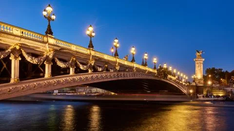 Panoramic view of the Pont Alexandre III bridge illuminated. Paris, France Stock Photos