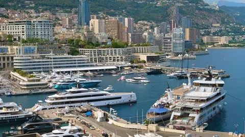 Panoramic view of port hercule in monaco with luxury yachts and monte carlo.. Video stock 339470795