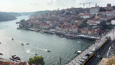 Panoramic view of Porto featuring the iconic Dom Luis I Bridge crossing the Stock-Footage 341365075