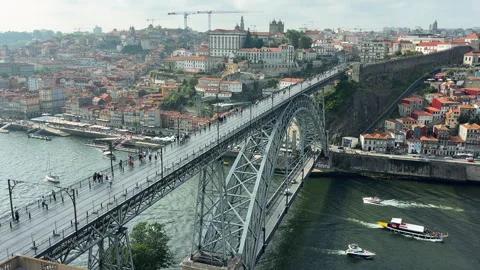 Panoramic view of Porto featuring the iconic Dom Luis I Bridge crossing the Stock Footage 341896573