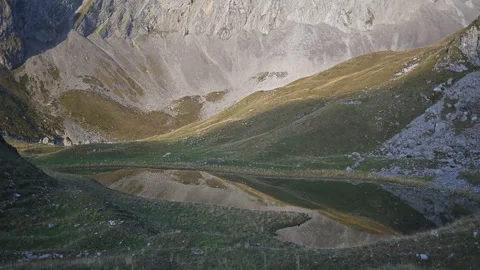 Panoramic view on a remote mountain lake Stock Footage 252622820