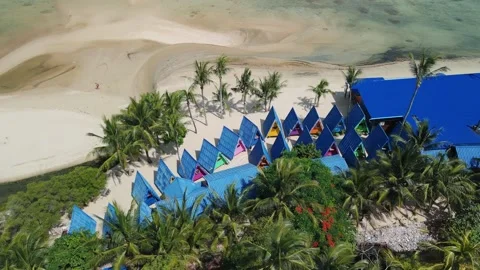 Panoramic view of remote Polynesian beach bungalows at sunset, wooden huts Stock Footage 312749609