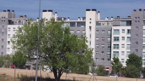 Panoramic view of residential high-rise buildings with green trees in front Stock Footage 336558681