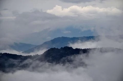 Panoramic view of ridges with cloud, silvery mist Stock Photos
