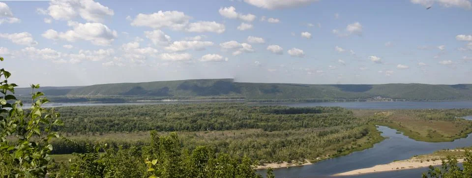 Panoramic view of the river and forest on a sunny day Stock Photos