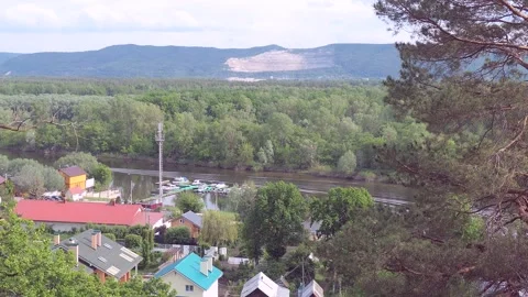 Panoramic view of the river and mountains from the hill. a boat on the river. Stock Footage 197081265