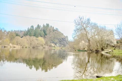 Panoramic view of river with emerald water and boats in the early spring Stock Photos