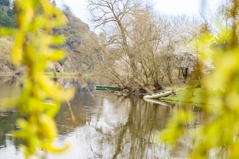 Panoramic view of river with emerald water and boats in the early spring Stock Photos