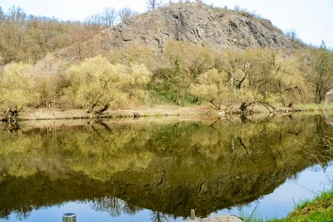 Panoramic view of river with emerald water and boats in the early spring Stock Photos