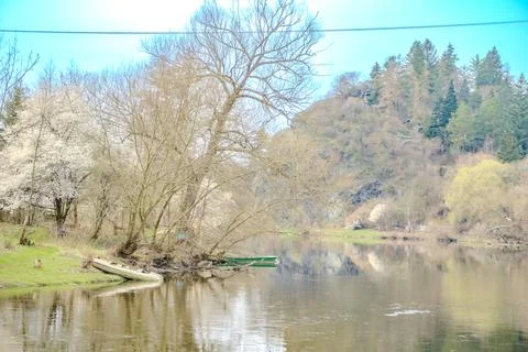 Panoramic view of river with emerald water and boats in the early spring Stock Photos