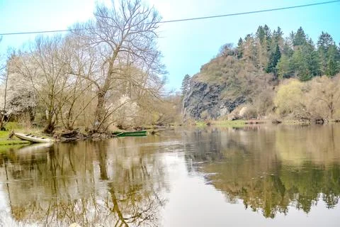 Panoramic view of river with emerald water and boats in the early spring Stock Photos