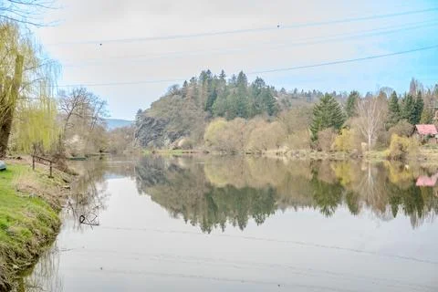 Panoramic view of river with emerald water and boats in the early spring Stock Photos