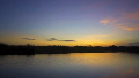 Panoramic View of River at Sunrise with Clear Sky Stock Footage 293893189