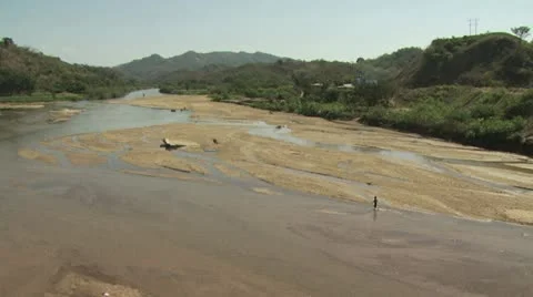 Panoramic View of Riverbed with Mountains In The Background Video stock 19033096