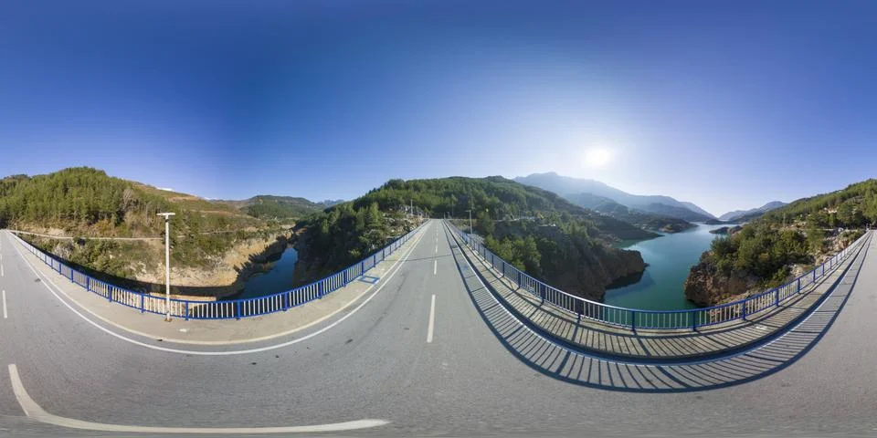 Panoramic View of a Road Bridge Overlooking a River Canyon with Dense Green Stock Photos