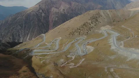 Panoramic view of the road which passing through Kyrgyzstan mountains. Too-Ashu Video stock 321858595