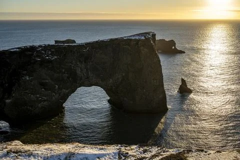 Panoramic view of rock cliffs with sunshine on the coast from Dyrholaey Stock Photos