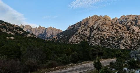 Panoramic view of the rock formations of La Pedriza. Peak Sirio. Stock Photos