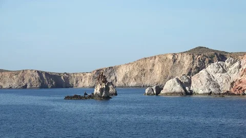 Panoramic view of rock formations near Milos island. Tranquil seascape of Greece Stock Footage 117658789