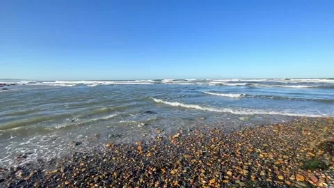 Panoramic view from a rocky beach of an island with palm trees. Stock Footage 337591885