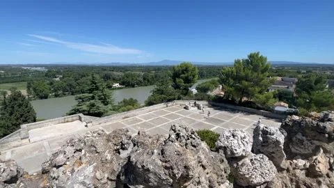 Panoramic view from a rocky green landscape and water in Avignon Stock Footage 344391615
