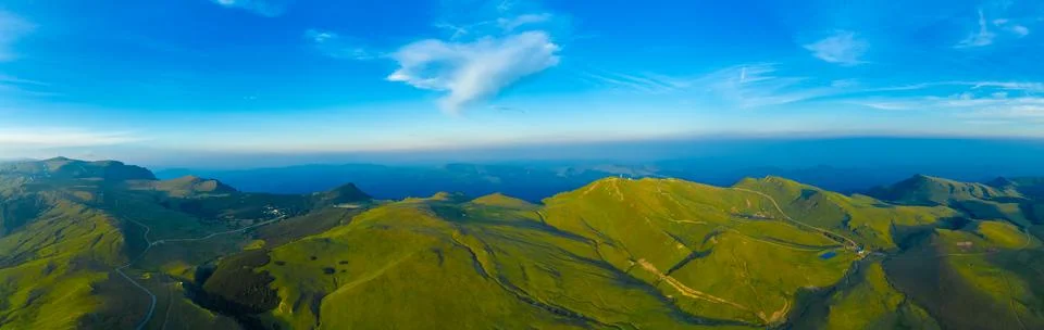 Panoramic view of the rolling green Bucegi mountains - Romania Stock Photos