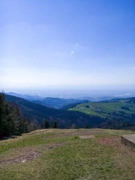 Panoramic view of rolling hills and valleys under blue sky 스톡 사진