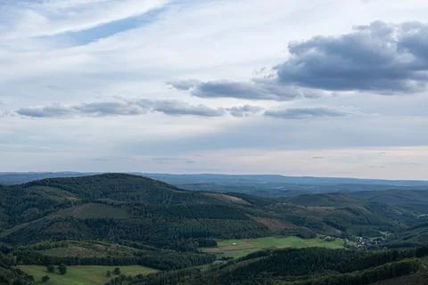 Panoramic view of rolling hills with fields and forests. Stock Photos