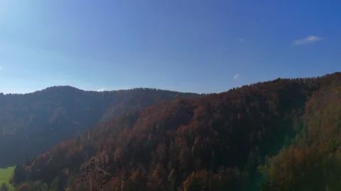 Panoramic View of Rolling Hills Under a Clear Blue Sky Stock Footage 291820430