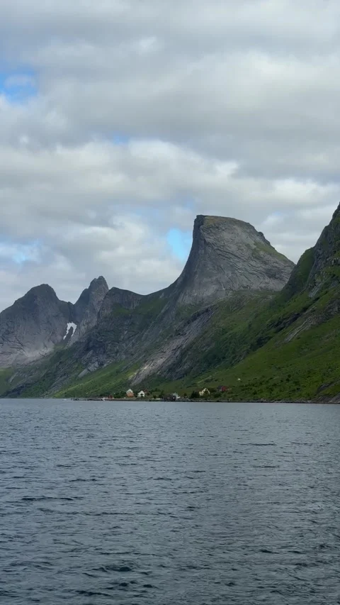 Panoramic view of the rugged granite mountains from the ferry crossing Reinefjor Stock Footage 334780426