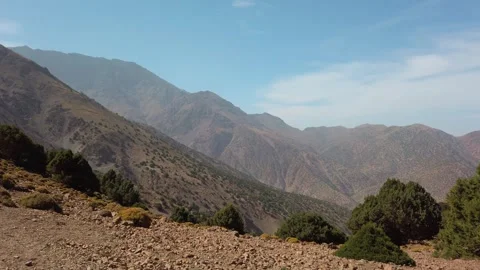 Panoramic view of rugged mountain slopes with juniper trees in the High Atlas Stock Footage 332256620