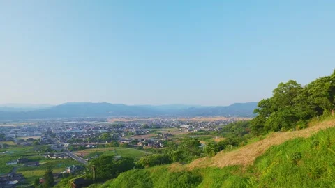 Panoramic view of the rural Chikugo Plains and lush green mountains in Ukiha Stock Footage 335257067