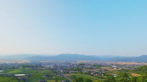 Panoramic view of the rural Chikugo Plains and lush green mountains in Ukiha Stock Footage 335257071
