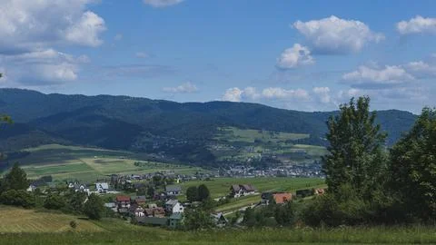 Panoramic View of Rural Valley Surrounded by Forested Hills Photos