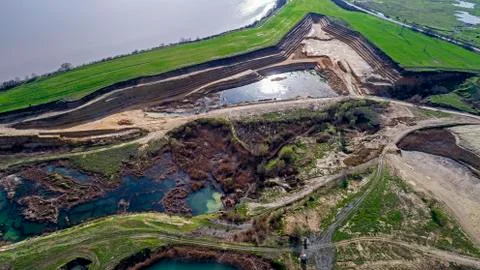 Panoramic view of sand quarry, mining of yellow construction sand, pumping sand  Stock Photos