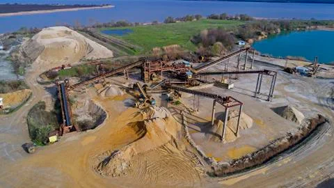 Panoramic view of sand quarry, mining of yellow construction sand, pumping sand  Stock Photos